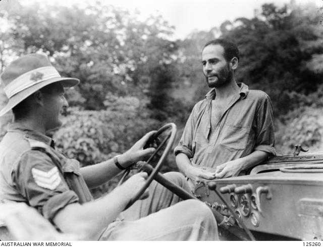 1535176380_125260-DILIPORTUGUESETIMOR.1946-01-11.SERGEANTG.MILSOM(LEFT)TALKINGTOVASCOMARIADEMARCAL....jpg.549186ebc500691d435ba3b9b2fc77a0.jpg