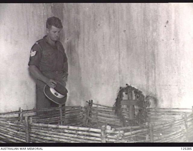 797128737_125285-AINAROPORTUGUESETIMOR.1946-01-24.SERGEANTG.MILSOMMILITARYHISTORYSECTIONFIELDTEAMAND-NDENTCOMPANYSTANDSBESIDETHEGRAVEOFTHREEPORTUGUESEPRIESTS....jpg.10fbd8d3cf982e23440128d4cd559272.jpg